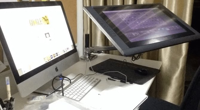 The Ergotron arm installed on my desk to support my Wacom Cintiq 22HD